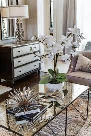 Maybe you would like to learn more about one of these? Pretty White Orchid Adorns Mercury Glass Coffee Table Coffe Table Decor Glass Coffee Table Decor Elegant Coffee Table