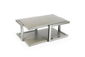 A spacious tabletop and a large bottom shelf provide ample storage and display space. Alistair Small Rectangle Cocktail Table Suburban Contemporary Furniture