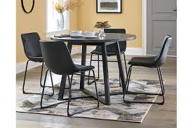 A hardwood top with a walnut finish floats on black metal hairpin legs. Centiar Dining Table Ashley Furniture Homestore