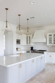 How much do kitchen cabinets cost? California Home Remodel Kitchen After Bright White Island Grey Cabinets Gold Light Fixtures Homeremo Kitchen Remodel Trends Home Decor Kitchen Kitchen Remodel