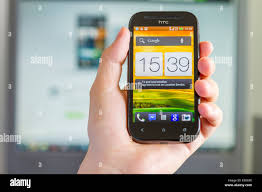 Hand holding an HTC One SV features a 4 ...