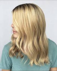 Thick hair is made light and bouncy with fun wispy pieces cut throughout the frame of the. 37 Medium Length Hairstyles And Haircuts For 2021