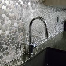You can also find models with great features like backsplashes and marine edges, both of which keep liquid and other items from falling off of the table. Stainless Steel Metal Silver Pebble Mosaic Tile For Kitchen Backsplash Wall 3 X 6 Sample 7 99 Buy Online In Qatar At Qatar Desertcart Com Productid 56614215