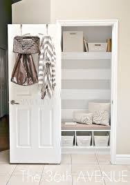 This mudroom off the back door serves as the home's primary entrance for a family of four. Remodelaholic Get This Look Small Space Mudroom Under The Stairs