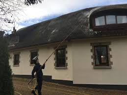 Why use thatch for a roof? Thatched Roof Maintenance Cleaning Moss From A Thatched Roof