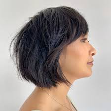A razored bob to give Michelle's straight hair max texture. I've been used  the razor slowly