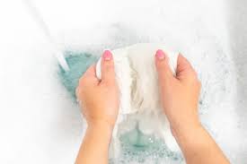 Learn which colors you can wash together and what you should avoid doing. Premium Photo Female Hands Washing Color Clothes In Sink