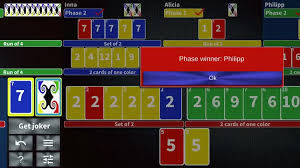 I remember living in phoenix and having game night at my apartment. Phase Rummy Card Game By Paul Burlov