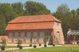 The color palette of white and neutrals lend to the blending of indoors and out. Orangerie