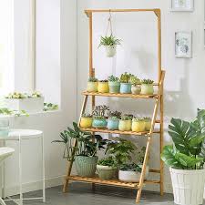 😳 for a special project i've got coming up (more on that later…!), i needed to reset the entire house back to all of the springtime looks i'd created, including this hanging flowers and plants display in our farmhouse style. 3 Tier Foldable Plant Stand Ladder Shelf With Hanging Bar Wood Color