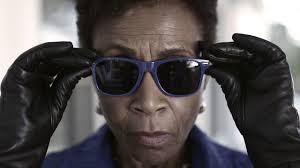 Lowering her visor, KU...