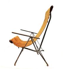 Elevating the decor of any modern office, it provides ergonomic lumbar support for your back as well as ribbed faux white leather sling seating that conforms to your body's sitting position. Leather Sling Chair No 2 Chris Cole Designs