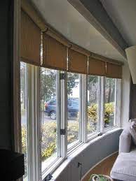 Bulky window treatments with large headrails will protrude far out of your window and will leave large gaps in the. Window Covering Ideas For A Large Bow Window Window Treatments Living Room Bay Window Treatments Bow Window Living Room