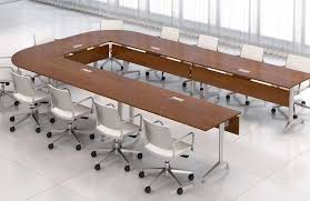 For example, wood conference tables may pair well with traditional office environments, while glass conference tables can nicely fit modern decor. Conference Room Tables Glass Wood Modular Table Conference Table Modern Conference Table