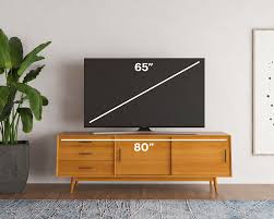 The smart design also adds two shelves with a unique ability to swivel, so your tv can be directed up to 15 degrees in all directions by pivoting the mounting section. How To Find The Best Tv Stand For Your Tv Size Modsy Blog
