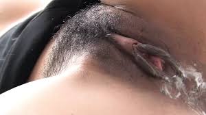 Japanese Bitch Gags on a Hard Cock as another Thrusts Her