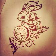 Rabbits have long been associated with spring and easter as the easter bunny but are also loved by people for many of their symbolic meanings like fertility or rebirth, luck, prosperity, and wealth. Rabbits Tattoos On Bodies Rabbit Tattoos Bunny Tattoos Clock Tattoo Design