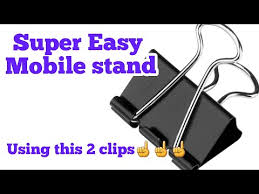 Take a piece of your tape slightly larger than the binder and apply it to the bottom of the binder. Video Binder Clip Mobile Stand