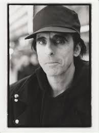 Older black and white photo of a grumpy man