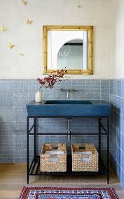 blue stone sink vanity with gold bamboo