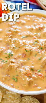 Easy And Cheesy This 4 Ingredient Rotel Dip Is Easy To Make We Add Ground Beef Or Sausage To Create A Hearty Party F In 2020 Rotel Dip Rotel Recipes Appetizer Recipes