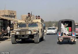 The militiamen planted their flag in the main square of kunduz city, where it was seen flying atop a traffic police booth, a video obtained by the associated press showed. Taliban Storm Afghan City Of Kunduz And Free Hundreds Of Militants Daily Mail Online