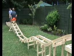 Homemade Roller Coaster Part 4 Us Riding On It Youtube Homemade Roller Coaster Backyard Diy Projects Backyard Fun