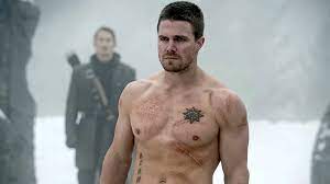 Stephen Amell Goes Shirtless In Hot Pink Shorts With Post Saying He's Back  In Prime Green Arrow Shape | Cinemablend