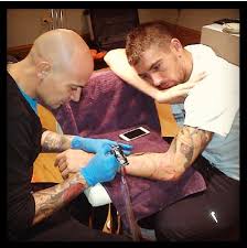 The tattoo on his left arm is the spanish mode of fernando in tengwar. Zlatan Ibrahimovic Football S For Girls