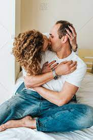 Share the best gifs now >>>. Husband And Wife Hugging Kissing And Looking Happy Stock Photo Offset