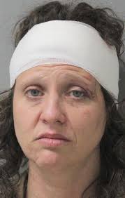 Woman bangs head against cage in police car after being arrested for  attacking man, spitting