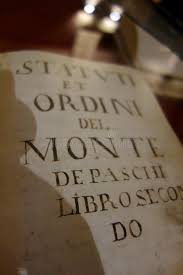Monte dei paschi di siena's claim to be the world's oldest surviving bank dates to its origins in 1472 in the tuscan city from which it derives its name. Monte Dei Paschi Di Siena Bank Museum Open Book With Bokeh Effect Of The Original 1472 Statute Of Banca Mps Spa Stock Photo Image Of Isolated Research 172518264