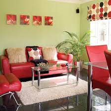 Using warm hues of red, you can highlight the earthiness of green. Green Red Living Room Ideal Home Living Room Green Colourful Living Room Living Room Colors