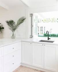 The white cabinets contrast with black countertops, and they would look off if it weren't of the mid tones. 12 Best White Kitchen Cabinets Black Hinges And Hardware Ideas White Kitchen Cabinets Kitchen Cabinets New Kitchen