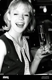 Geraldine Sinclair using new cutlery and glasses at the Steak Encore  restaurant Leicester Square July 1963 Stock Photo