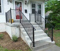 Small brick porch with wrought iron railing. Perpetua Iron Simple Railing Page 2