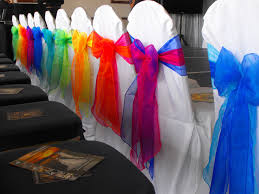 mixed double rainbow colours organza bows on white chair covers chair covers wedding rainbow wedding decorations colorful chairs
