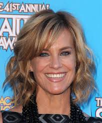 Catherine Mary Stewart Medium Wavy Dark Blonde Hairstyle With Side Swept Bangs Catherine Mary Stewart Wavy Hairstyles Medium Dark Blonde Hair Color