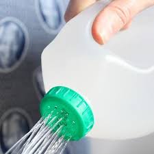 Clever Easy Way To Turn A Plastic Jug Into A Dripless Easy To Carry Watering Spout Simply Take A Sewing Needle Household Hacks Gardening Tips Watering Can