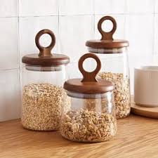 This generous snapware food storage containerthis generous snapware food storage container is perfect when you want to prepare party foods 28 oz. Textured Stoneware Kitchen Canisters W Wood Tops White In 2021 Glass Food Storage Containers Clear Glass Canisters Kitchen Canisters