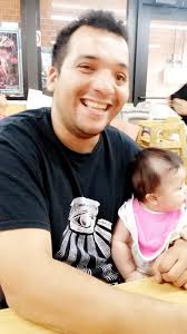 Man cutting child's hair with garden shears in the United Kingdom around  1920