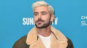 A new picture of zac efron on set for the beach bum has surfaced on twitter, and fans are freaking out about his new look. Zac Efron S Hair For The Beach Bum Was Inspired By A Panini Teen Vogue