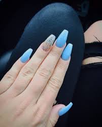The newest coffin nail designs are so perfect for winter 2018! Light Blue And Glitter Coffin Nails Coffin Nails Acrylic Nails Coffin Glitter Blue Acrylic Nails Black Acrylic Nails