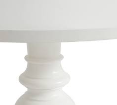 Featured in a neutral, weathered grey to match any decor, this coffee table will enhance your space with simplicity and elegance. Dawson Round Pedestal Dining Table Pottery Barn