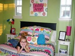 Textured accessories like a fur throw, a glossy green plant and a nubby gray bench keep this pretty bedroom from becoming too precious. Pin On Green Girls Room