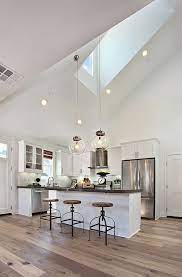 With a vaulted ceiling, look for interesting chandeliers and pendant lights for style and add recessed lighting for additional ambient illumination. 11 Sloped Ceiling Ideas Sloped Ceiling House Design Ceiling