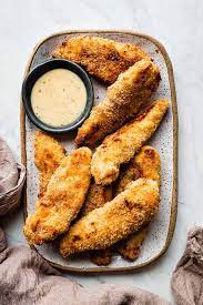 · spray tops of dredged chicken tenders with olive oil spray. Easy Baked Gluten Free Chicken Strips The Movement Menu