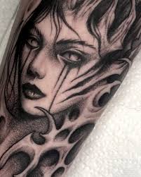 Lady face tattoo from my predrawn designs. Loved tattooing this today for  the very lovely @kati.e_leonard Thank you 🖤 Using @rawtattoosupplies  @cheyenne_tattooequipment @kwadron @eclipse.tattooink #ladyfacetattoo  #darkart #darktattoo #darkartist ...