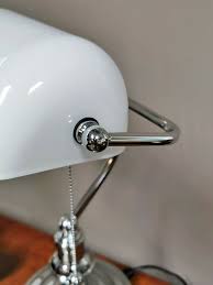 A skylight in a roof that admits light from above; Bankers Lamp Chrome White Frosted Glass English Decorations