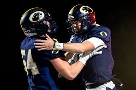 Larner twins set tone for DeWitt football in perfect regular season